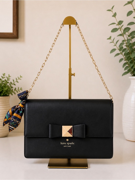 kate spade Handbags - Kate Spade New York Black Leather Clutch Bag with Shoulder Strap and Bow Accent